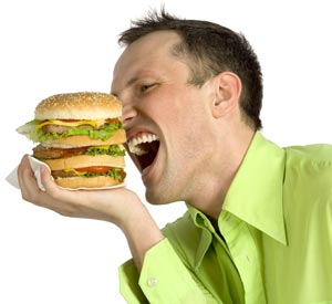 Man eating a large burger