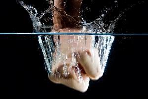 A hand punching in the water