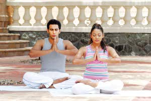 Couple doing yogasana