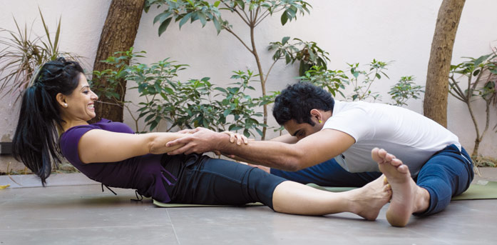 Forward fold pose as done in couple yoga
