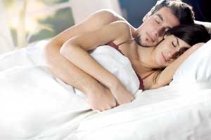 Couple sleeping in an intimate way