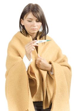 sick woman checking temperature