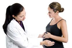 Happy pregnant lady with doctor
