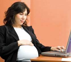 pregnant woman working on a computer