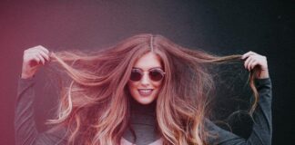 10 super tips for thick, shiny and healthy hair blonde woman showing off her long healthy hair