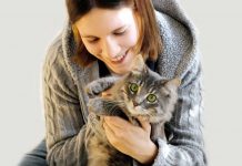 woman holding a cat