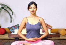 Why Chanting Mantras Is a Wonderful Habit A woman sitting in lotus pose, preparing for chanting mantras