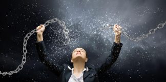 Attachment vs. Detachment + 7 Steps to Cultivate Detachment Woman breaking a chain with her hands / concept of detachment