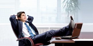 Man keep legs on the desk and relaxing