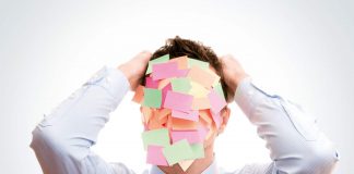 This New Year, Just Stop and Be Mindful Coloured postage stamps on man face / concept of New Year resolutions