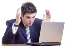 man looking tensed working in office