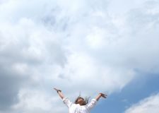 Thinking about death can be good for you Woman jumping with joy