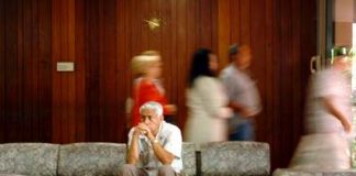 Wife’s breast cancer affects husbands health Man waiting in hospital waiting room