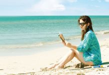 woman sitting on a beach