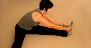 Woman performing leg stretch