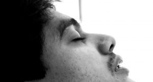 man sleeping with earphones