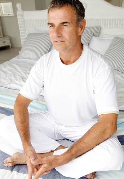 Man doing the mindfulness exercise after waking up in the morning