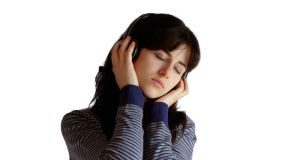Music rocks more after mindfulness meditation Girl with headphones