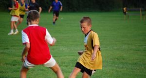 boys playing football