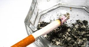 Cigarette in ashtray