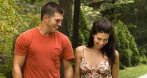 Pets may help lower risk of heart disease Man and woman with a pet dog