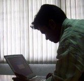 Man with laptop on table