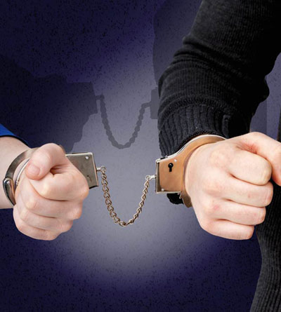 Two men tied with handcuffs