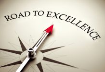 Compass pointing towards excellence