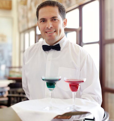 Waiter serving a drink