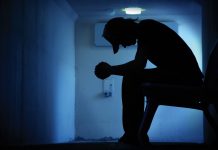Man sitting in misery