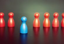 How to create your unique style of leadership isolated blue chess pawn among red pawns