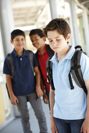 School boys bullying a fellow student