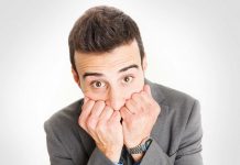 The curious case of the Imposter Syndrome Man looking nervous with hands on face / imposter syndrome