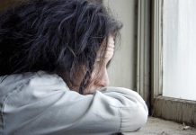 Distraught woman looking outside the window / how to move on