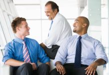 Why a Leader Must Walk Slowly Through the Halls Boss having a friendly conversation with his employees