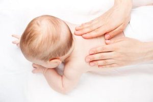 For newborns, gentle massage by parents is recommended 
