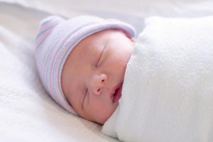 Newborn baby swaddled