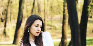 Beautiful sad girl in the woods