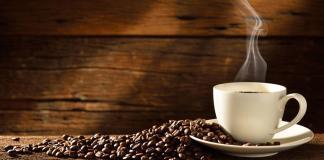 The many perks of drinking coffee Cup of coffee with coffee beans