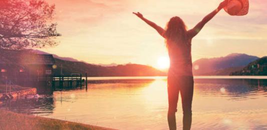 woman with arms outstretched. happiness