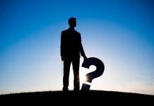 Man holding question mark,life questions