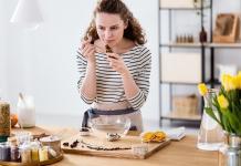 woman smelling essential oils