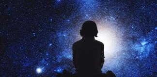 sihoutte against a dark starry night / universe