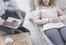 Woman in hypnosis lying on sofa