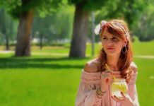 woman in park drinking lemonade, summer