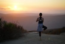 women doing yoga, sunset