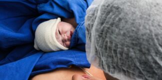 Novel Treatment for Newborn Babies Needing Emergency Blood Transfusion New born baby right after delivery with mother and father | newborn babies concept