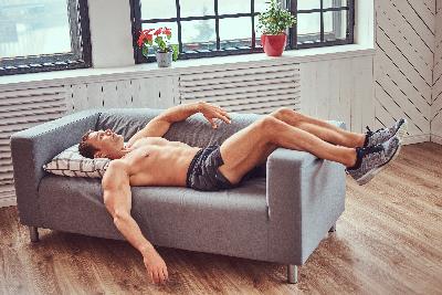 Man resting for muscle recovery after workout