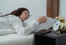 Woman sleeping while listening to bedtime stories and relaxing music