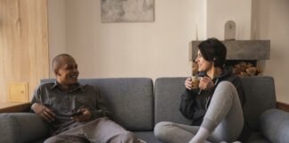 Even asexual individuals can forge successful romantic relationships: New Study A happy couple on sofa | asexual relationships concept